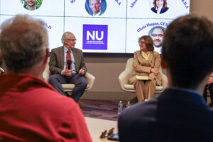 Two panelist sitting on stage